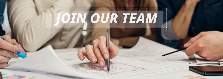 Close-up of hands writing and pointing on documents with Join Our Team text overlay.